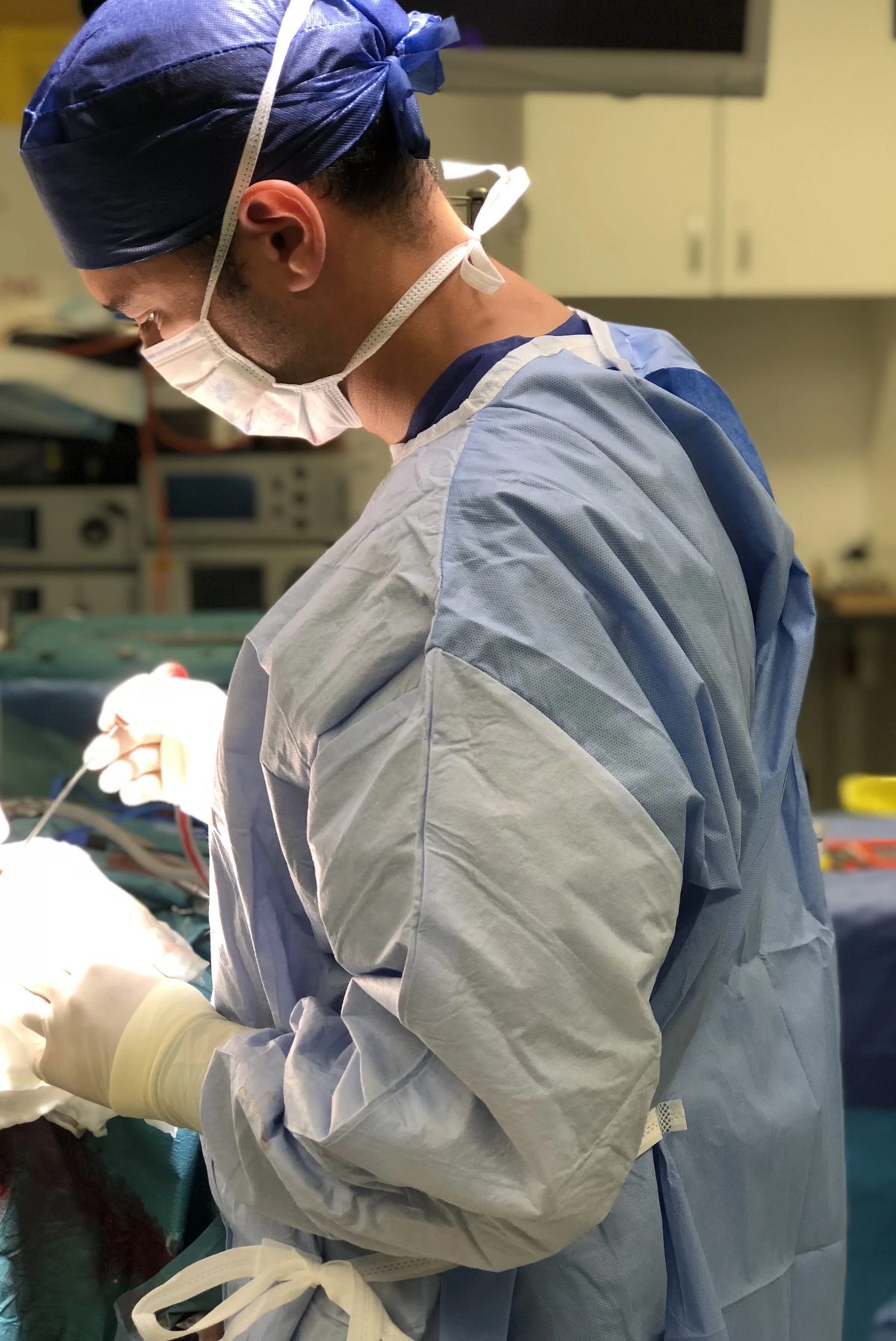Dr. Omar Arnaout performing surgery in the operating room